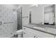 Modern bathroom with a glass-enclosed shower, geometric tile, and granite countertop at 4216 Tattnall Run, Acworth, GA 30101