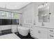 Bright and open bathroom with soaking tub, double vanity and lots of natural light at 4216 Tattnall Run, Acworth, GA 30101