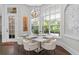 Bright breakfast nook with modern lighting and large windows at 4216 Tattnall Run, Acworth, GA 30101