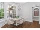 Bright breakfast nook with modern lighting and a view of the backyard at 4216 Tattnall Run, Acworth, GA 30101