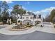 Elegant gated community entrance with manicured landscaping, brick pillars, and stylish architecture at 4216 Tattnall Run, Acworth, GA 30101