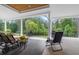 Enjoy the outdoors on this covered patio, featuring ample seating and views of the lush, green yard at 4216 Tattnall Run, Acworth, GA 30101