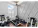 Exercise room with a ceiling fan, fitness machines, and ample natural light at 4216 Tattnall Run, Acworth, GA 30101
