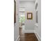 Hallway featuring hardwood floors, and an arched window with natural light at 4216 Tattnall Run, Acworth, GA 30101