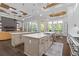 Kitchen with an island, stainless steel appliances, and an eat-in breakfast nook at 4216 Tattnall Run, Acworth, GA 30101