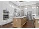 Stunning kitchen with custom cabinets, marble countertops, and stainless steel appliances at 4216 Tattnall Run, Acworth, GA 30101