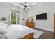 Bright main bedroom features a tray ceiling, private balcony, and modern furnishings at 4216 Tattnall Run, Acworth, GA 30101