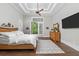 Bright main bedroom features a tray ceiling, private balcony, and modern furnishings at 4216 Tattnall Run, Acworth, GA 30101