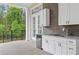 This outdoor kitchen features white cabinets and stainless steel appliances at 4216 Tattnall Run, Acworth, GA 30101