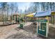 Community playground featuring various slides, play structures, and shaded seating for children and families at 4216 Tattnall Run, Acworth, GA 30101