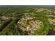 An aerial view of homes with manicured lawns in a quiet, wooded neighborhood at 5015 Preservation Pointe Nw, Kennesaw, GA 30152