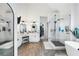 Bathroom with dual vanity sinks, glass shower, and white cabinets in a modern design at 5015 Preservation Pointe Nw, Kennesaw, GA 30152