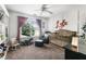 Bedroom with a crib, rocking chair, decorative wall art, and ample natural light at 5015 Preservation Pointe Nw, Kennesaw, GA 30152