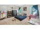 Bedroom featuring neutral-toned carpet, two windows, and decor with sport theme at 5015 Preservation Pointe Nw, Kennesaw, GA 30152