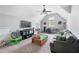 Large bonus room with toys, couch, television and ceiling fan at 5015 Preservation Pointe Nw, Kennesaw, GA 30152