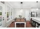 Bright breakfast nook with a view of the outdoors, and access to kitchen at 5015 Preservation Pointe Nw, Kennesaw, GA 30152