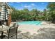 Community pool with lounge chairs and tables for relaxing by the pool at 5015 Preservation Pointe Nw, Kennesaw, GA 30152
