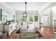 Traditional dining room features a long dark wood table with rustic charm and natural light at 5015 Preservation Pointe Nw, Kennesaw, GA 30152