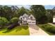 Charming two-story home with lush landscaping and a well-manicured lawn at 5015 Preservation Pointe Nw, Kennesaw, GA 30152