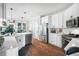 Kitchen with stainless steel appliances, a breakfast bar, and access to the screened porch is great for entertaining at 5015 Preservation Pointe Nw, Kennesaw, GA 30152