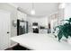 Bright kitchen showcasing white cabinetry, stainless steel appliances, and a breakfast bar for modern appeal at 5015 Preservation Pointe Nw, Kennesaw, GA 30152