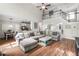 Large living room with comfortable seating, view of the stairway and open layout at 5015 Preservation Pointe Nw, Kennesaw, GA 30152