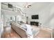 Bright, open living room featuring a vaulted ceiling, fireplace, and comfortable seating arrangement at 5015 Preservation Pointe Nw, Kennesaw, GA 30152