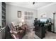 Comfortable office with a leather chair, built-in shelving, and a modern desk provides a productive work environment at 5015 Preservation Pointe Nw, Kennesaw, GA 30152