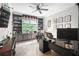 Office with wall-to-wall built-in shelving, a large window, and an oversized desk at 5015 Preservation Pointe Nw, Kennesaw, GA 30152