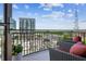 Enjoy city views from this condo's private balcony, complete with stylish seating and a black metal railing at 3180 Mathieson Ne Dr # 1001, Atlanta, GA 30305