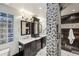 Stylish bathroom with double vanities, glass block window, and a modern pebble-tiled shower at 3180 Mathieson Ne Dr # 1001, Atlanta, GA 30305