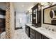 Modern bathroom featuring double vanities, stylish fixtures, and a unique pebbled shower design at 3180 Mathieson Ne Dr # 1001, Atlanta, GA 30305