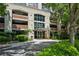 Welcoming building entrance with lush landscaping at 3180 Mathieson Ne Dr # 1001, Atlanta, GA 30305