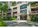 Welcoming building entrance with lush landscaping and covered drive at 3180 Mathieson Ne Dr # 1001, Atlanta, GA 30305