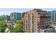 Stunning exterior view of a multi-story brick building with balconies and city views at 3180 Mathieson Ne Dr # 1001, Atlanta, GA 30305