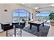 Bright game room with a pool table, bar seating, and expansive windows offering panoramic views at 3180 Mathieson Ne Dr # 1001, Atlanta, GA 30305