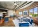 Bright and airy living room with exposed brick walls, large windows, and stylish contemporary furnishings at 3180 Mathieson Ne Dr # 1001, Atlanta, GA 30305