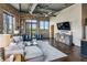 Loft-style living room with exposed brick, ductwork, hardwood floors, and a view to the outside at 3180 Mathieson Ne Dr # 1001, Atlanta, GA 30305