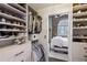 Custom walk-in closet with ample storage space and a glimpse of the bedroom at 3180 Mathieson Ne Dr # 1001, Atlanta, GA 30305