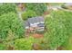 Aerial view of home featuring a large deck, patio, and beautifully landscaped backyard at 4140 Summit Dr, Marietta, GA 30068