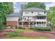 Spacious backyard with deck, patio, landscaped garden and mature trees at 4140 Summit Dr, Marietta, GA 30068