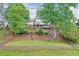Large lot featuring a landscaped garden and patio, perfect for outdoor relaxation at 4140 Summit Dr, Marietta, GA 30068