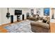 This spacious basement features a plush sectional sofa, flat screen tv, speakers and guitar making it perfect for relaxing at 4140 Summit Dr, Marietta, GA 30068