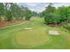 Scenic aerial view of a golf course with lush green fairways and sand traps at 4140 Summit Dr, Marietta, GA 30068