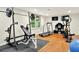 Bright home gym with wood floors, exercise equipment, and natural light at 4140 Summit Dr, Marietta, GA 30068