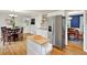 Spacious kitchen with a stainless refrigerator, hardwood floors and eat-in dining area at 4140 Summit Dr, Marietta, GA 30068