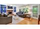 Inviting living room with a brick fireplace, built-in shelves, comfortable seating, and natural light at 4140 Summit Dr, Marietta, GA 30068