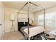 Bright bedroom with a four poster bed, side tables, and a ceiling fan providing ample lighting and a spacious feel at 5888 Cobblestone Creek Cir, Mableton, GA 30126