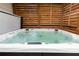 Inviting hot tub with crystal clear water, wood paneling and relaxing atmosphere at 5888 Cobblestone Creek Cir, Mableton, GA 30126