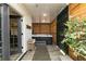Relaxing hot tub area features wood slat walls, decorative tree and convenient access door at 5888 Cobblestone Creek Cir, Mableton, GA 30126